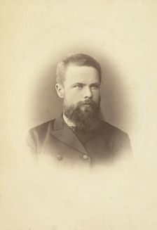 K Mikhailov, head-and-shoulders portrait, facing slightly right, between 1880 and 1886. Creator: Unknown