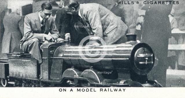 'On a Model Railway', 1925 (1937). Artist: Unknown.
