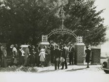 On All Saints Day at New Roads, La. African Americans lined up at gates to enter cemetry, 1938. Creators: Farm Security Administration, Russell Lee