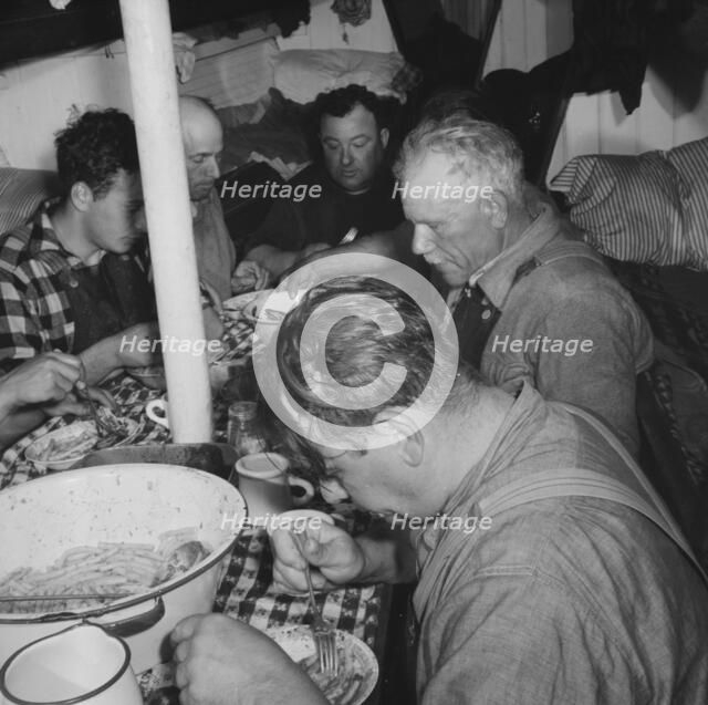 On board the fishing boat Alden, out of Gloucester, Massachusetts, 1943. Creator: Gordon Parks.