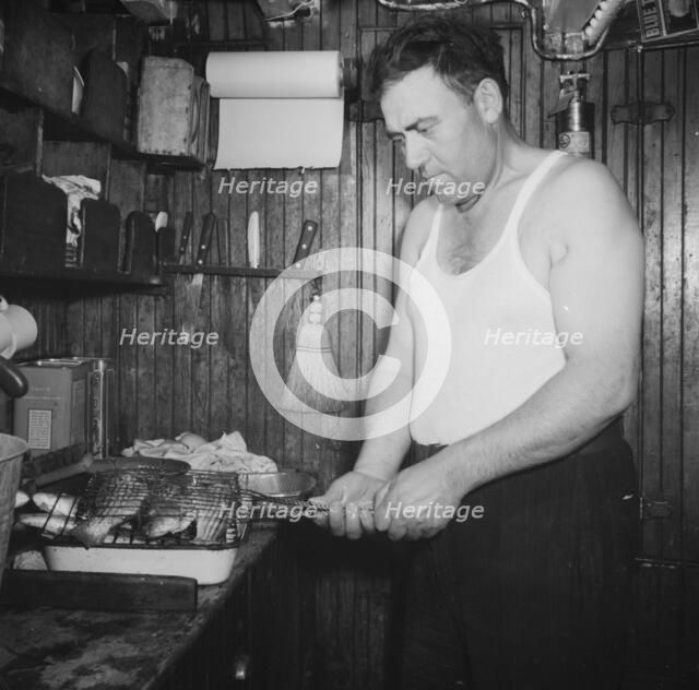 On board the fishing boat Alden, out of Gloucester, Massachusetts, 1943. Creator: Gordon Parks.