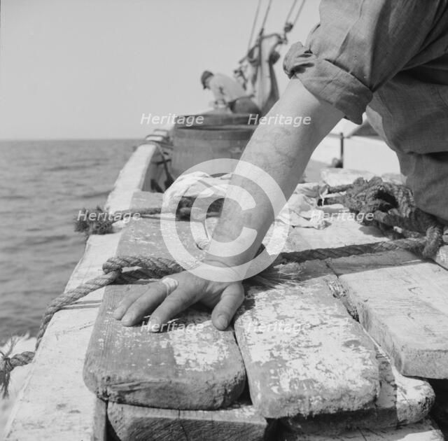 On board the fishing boat Alden out of Gloucester, Massachusetts, 1943. Creator: Gordon Parks.