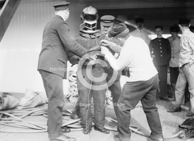 On KAISER WILHELM II - Buttoning up a fire-fighter, between c1910 and c1915. Creator: Bain News Service.