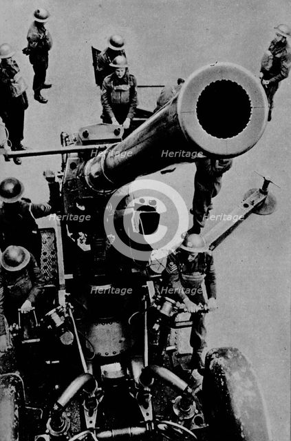 On target! - A 3.7 inch gun detachment at battle practice, 1943. Artist: Unknown.