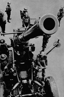 On target! - A 3.7 inch gun detachment at battle practice, 1943