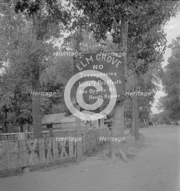 On the outskirts of a modern Oklahoma City within sight of its gleaming skyscrapers, 1936. Creator: Dorothea Lange.