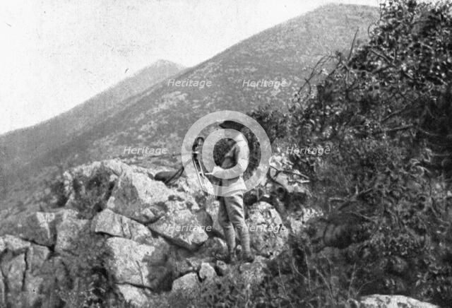 On the Eastern Front; An artillery observer in a position captured..., 1917. Creator: Unknown.