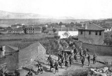On the Eastern Front; Our Zouaves cross Pogradec, at the southern end of Lake Ohrid..., 1917. Creator: Unknown