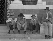 On the steps of the bank in the town square, Memphis, Texas, 1937. Creator: Dorothea Lange