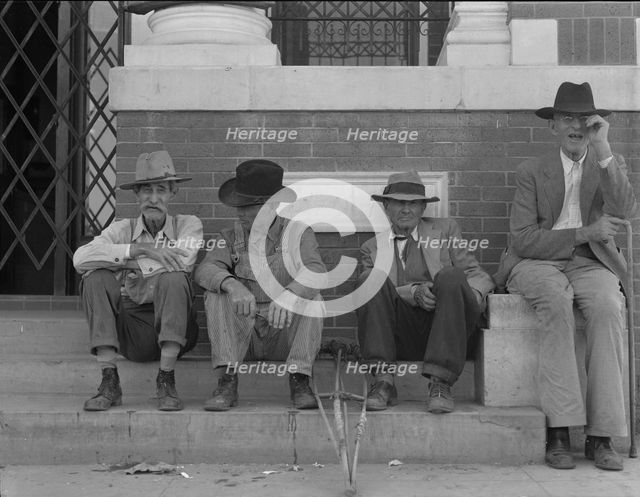 On the steps of the bank in the town square, Memphis, Texas, 1937. Creator: Dorothea Lange.