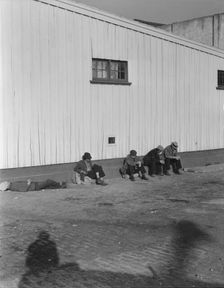 On the sun side of the shed, Transient men, San Francisco, California, 1936. Creator: Dorothea Lange