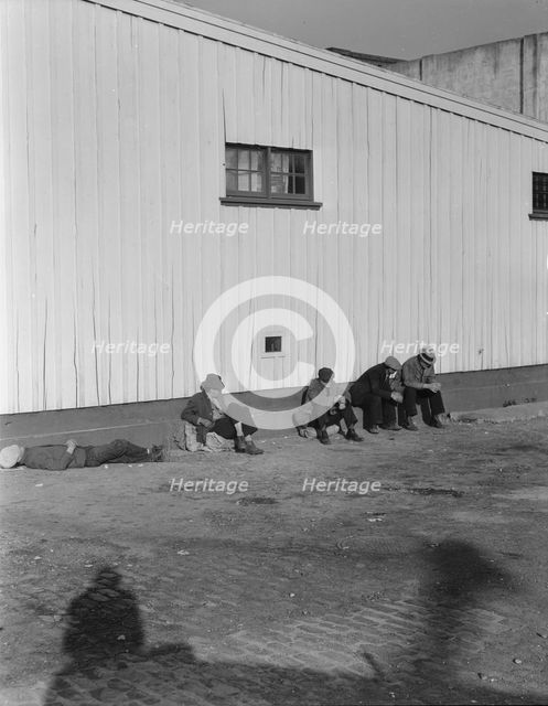 On the sun side of the shed, Transient men, San Francisco, California, 1936. Creator: Dorothea Lange.