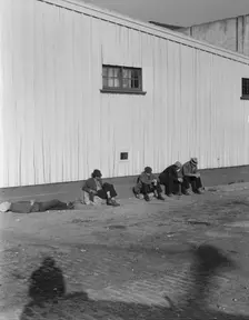 On the sun side of the shed, Transient men, San Francisco, California, 1936. Creator: Dorothea Lange