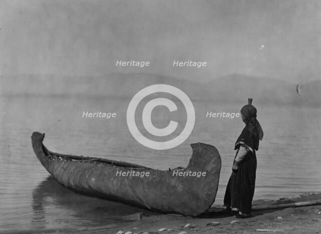 On the shore of the lake-Kutenai, c1910. Creator: Edward Sheriff Curtis.