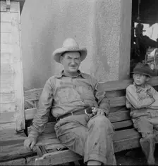 One of a group of western Oklahoma wheat farmers congregated at crossroads service station, 1938. Creator: Dorothea Lange