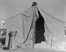 One of a row of tents, home of a pea picker, near Calipatria, Imperial Valley, CA, 1939. Creator: Dorothea Lange