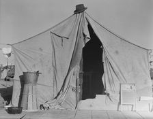 One of a row of tents, home of a pea picker, near Calipatria, Imperial Valley, CA, 1939. Creator: Dorothea Lange
