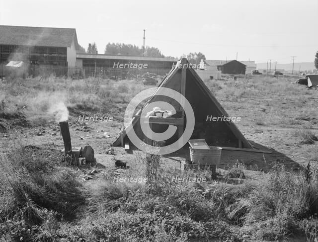 One of the forty potato camps in open field, entering town, Malin, Klamath County, Oregon, 1939. Creator: Dorothea Lange.