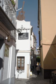 One of the narrow streets in the pedestrian area of the central city, Seville, Spain, 2023. Creator: Ethel Davies