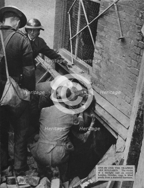 'One by one the trapped are released', 1940 (1942). Artist: Unknown.