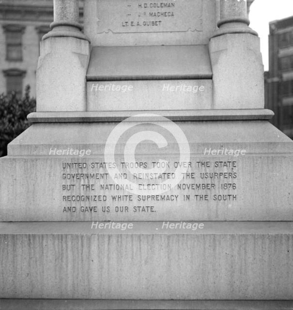 One side of the monument erected to race prejudice, New Orleans, Louisiana, 1936. Creator: Dorothea Lange.
