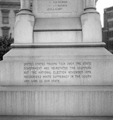 One side of the monument erected to race prejudice, New Orleans, Louisiana, 1936. Creator: Dorothea Lange