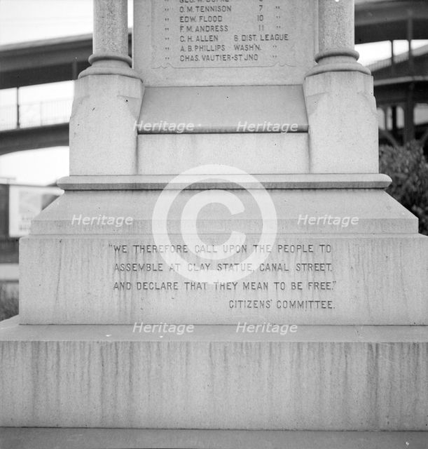 One side of the monument erected to race prejudice, New Orleans, Louisiana, 1936. Creator: Dorothea Lange.