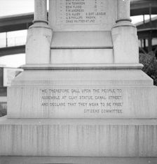 One side of the monument erected to race prejudice, New Orleans, Louisiana, 1936. Creator: Dorothea Lange