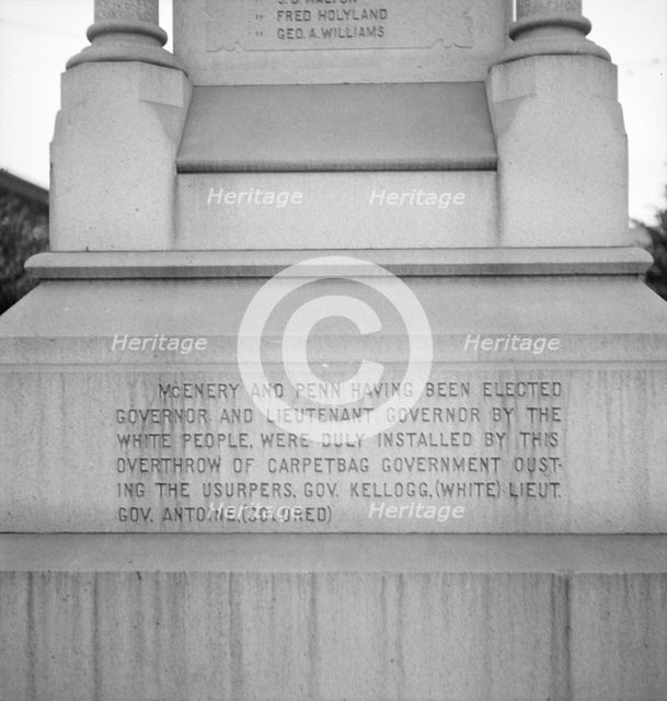 One side of the monument erected to race prejudice, New Orleans, Louisiana, 1936. Creator: Dorothea Lange.