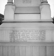 One side of the monument erected to race prejudice, New Orleans, Louisiana, 1936. Creator: Dorothea Lange