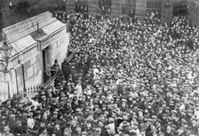 Onlookers gather at the Monument, London, captured by two suffragettes on 18th April 1913