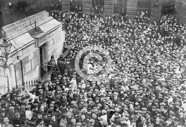 Onlookers gather at the Monument, London, captured by two suffragettes on 18th April 1913. Artist: Unknown