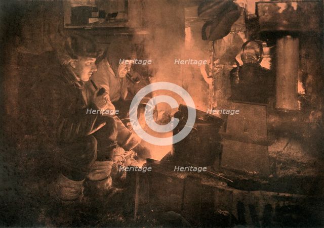 'Oates and Meares at the Blubber-Stove in the Stables', 1911, (1913). Artist: Herbert Ponting.
