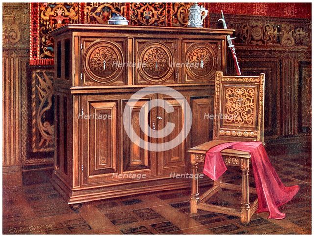 Oak cabinet and walnut chair, 1910.Artist: Edwin Foley