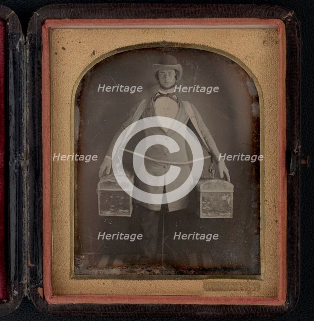 Occupational portrait of a peddler, full-length, standing, facing front..., between 1840 and 1860. Creator: Myers.