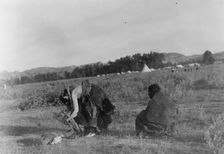 Offering pipe to the skull-Cheyenne, c1910. Creator: Edward Sheriff Curtis