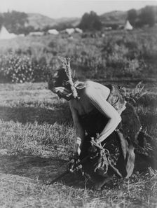 Offering the pipe to the Earth-Cheyenne, c1910. Creator: Edward Sheriff Curtis