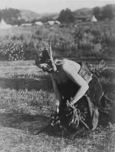 Offering the pipe to the Earth-Cheyenne, c1910. Creator: Edward Sheriff Curtis