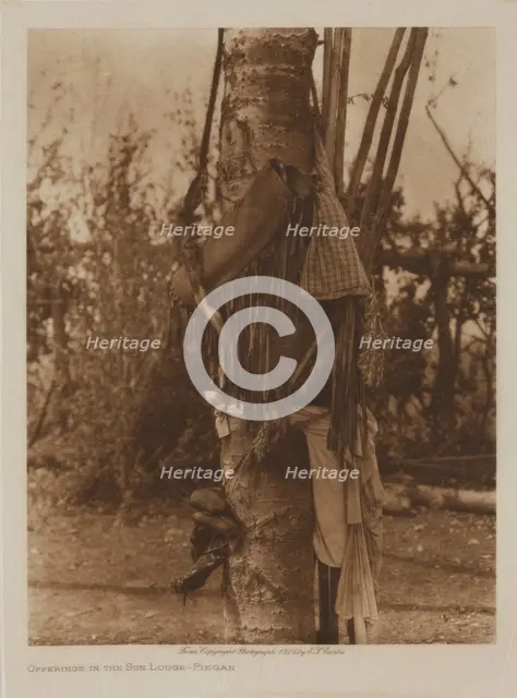Offerings in the Sun Lodge, Piegan, 1926. Creator: Edward Sheriff Curtis.