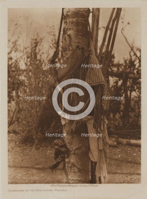 Offerings in the Sun Lodge, Piegan, 1926. Creator: Edward Sheriff Curtis.