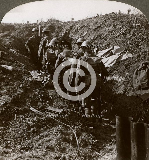 Officer watching his men file into a dug-out to avoid a German strafe, World War I, 1914-1918.Artist: Realistic Travels Publishers