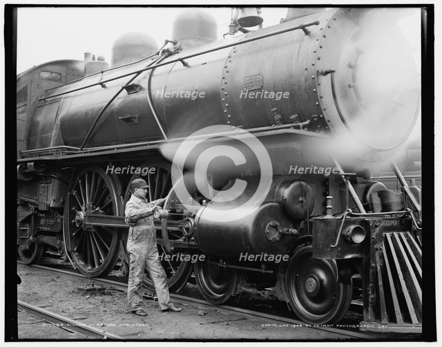 Oiling up before the start, c1904. Creator: Unknown.