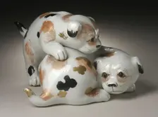 Okimono in the Form of a Pair of Gamboling Piebald Puppies, 19th century. Creator: Unknown