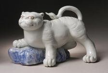 Okimono in the Form of a Tiger Climbing onto a Rock, 19th century. Creator: Unknown