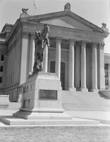 Oklahoma City state capitol, literally built on oil, Oklahoma, 1938. Creators: Dorothea Lange, Constance Whitney Warren