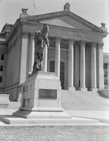 Oklahoma City state capitol, literally built on oil, Oklahoma, 1938. Creators: Dorothea Lange, Constance Whitney Warren