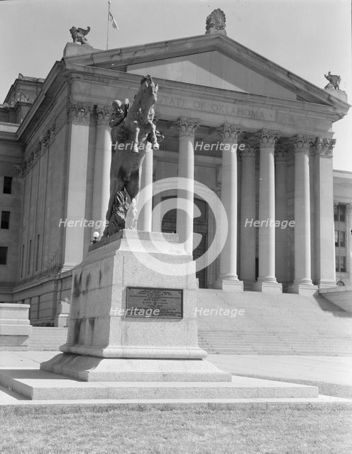Oklahoma City state capitol, literally built on oil, Oklahoma, 1938. Creators: Dorothea Lange, Constance Whitney Warren.