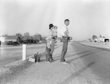 Oklahoma farm family on highway between Blythe and Indio - self-resettlement in California, 1936. Creator: Dorothea Lange