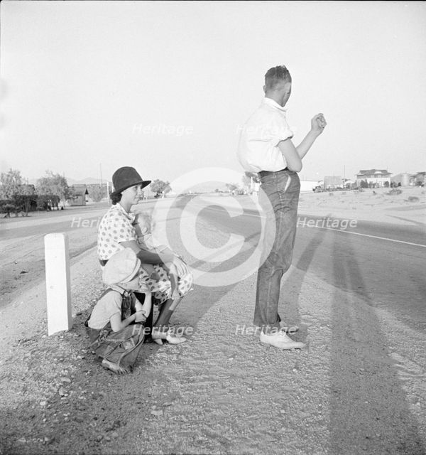 Oklahoma farm family on highway between Blythe and Indio - self-resettlement in California., 1936. Creator: Dorothea Lange.