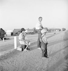 Oklahoma farm family on highway between Blythe and Indio - self-resettlement in California, 1936. Creator: Dorothea Lange